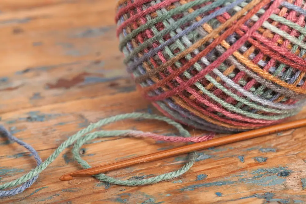 multicolored skein yarn and bamboo hook