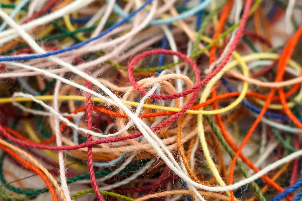 multiple colored skeins tangled yarn
